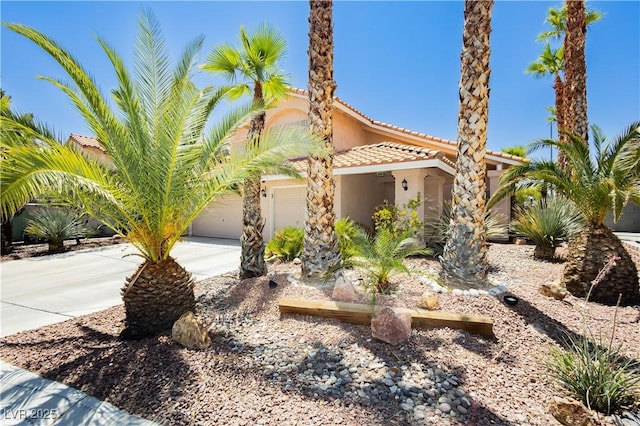 8875 Tidal Bay Dr, Las Vegas, NV 89117 - view of front of house featuring stucco siding, a tiled roof, driveway, and a garage