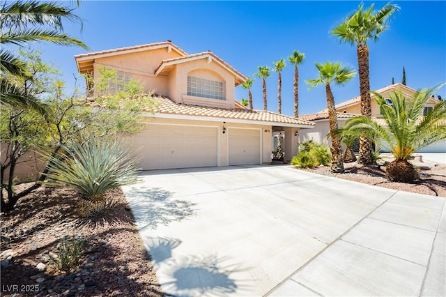 8875 Tidal Bay Dr, Las Vegas, NV 89117 - mediterranean / spanish house with stucco siding, concrete driveway, a tile roof, and a garage