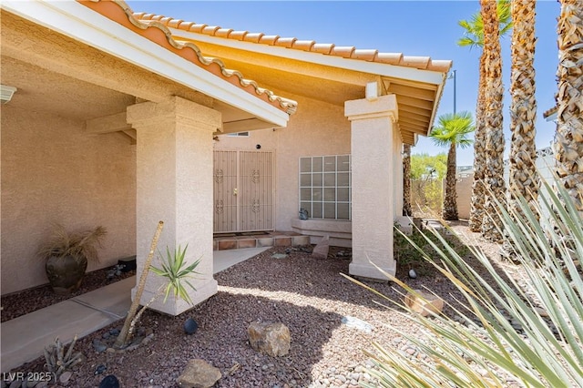 8875 Tidal Bay Dr, Las Vegas, NV 89117 - entrance to property with stucco siding and a tile roof