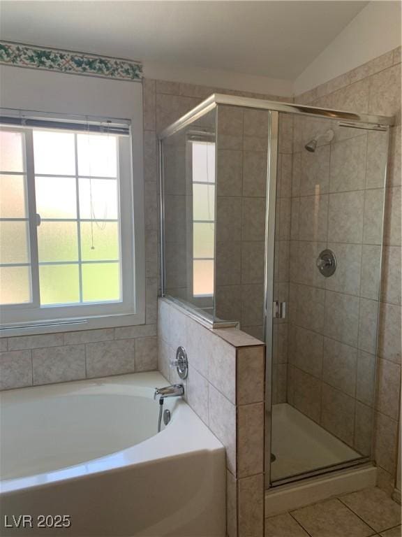 6704 Lost River Ct, Las Vegas, NV 89108 - bathroom featuring plenty of natural light, a garden tub, a stall shower, and lofted ceiling