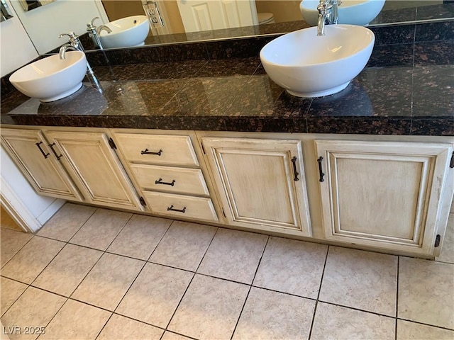 6704 Lost River Ct, Las Vegas, NV 89108 - bathroom with double vanity and tile patterned floors