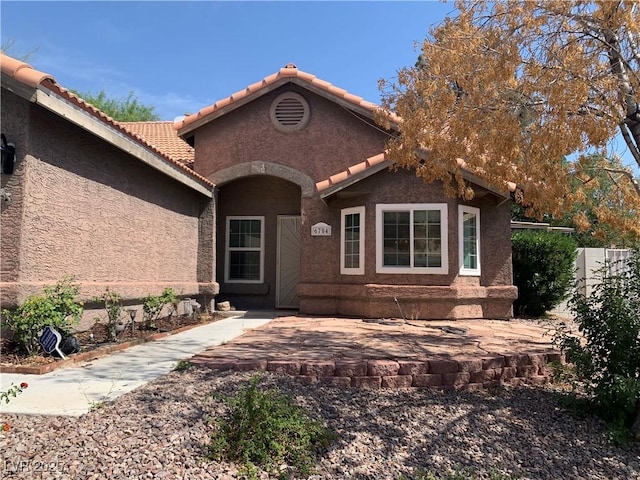 6704 Lost River Ct, Las Vegas, NV 89108 - view of front of home with a tiled roof and stucco siding