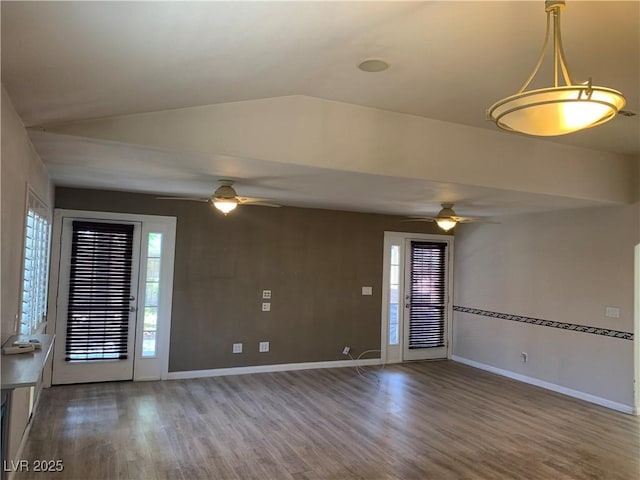 6704 Lost River Ct, Las Vegas, NV 89108 - spare room featuring a ceiling fan, wood finished floors, and vaulted ceiling