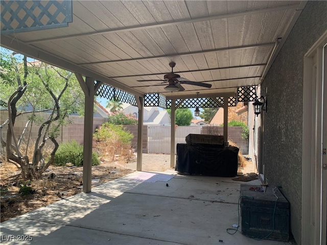 6704 Lost River Ct, Las Vegas, NV 89108 - fenced backyard with a ceiling fan and a patio area