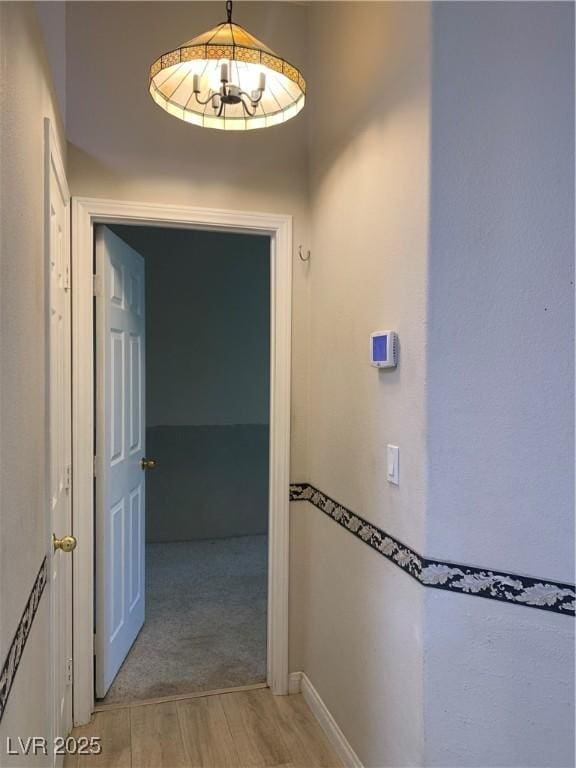 6704 Lost River Ct, Las Vegas, NV 89108 - hall featuring light wood finished floors and baseboards