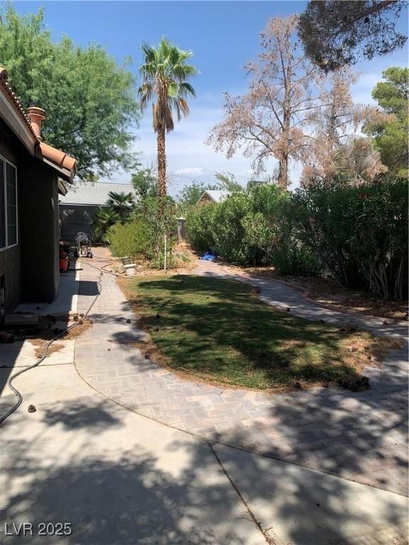 6704 Lost River Ct, Las Vegas, NV 89108 - view of green lawn with a patio