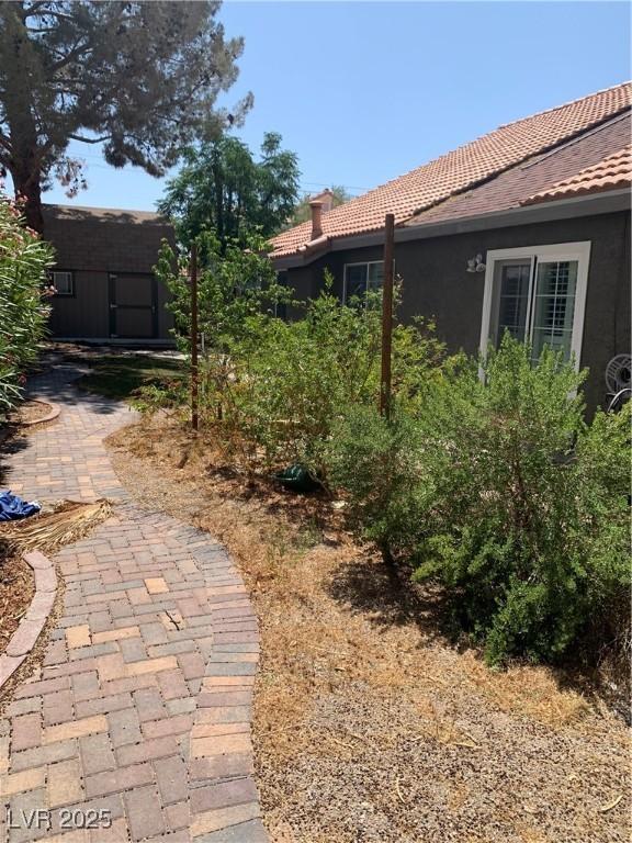 6704 Lost River Ct, Las Vegas, NV 89108 - view of yard with an outbuilding