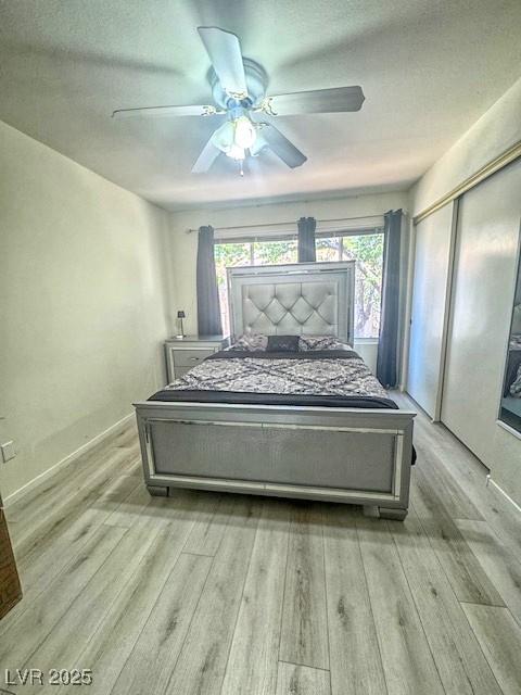 3101 Casey Dr Unit 204, Las Vegas, NV 89120 - bedroom featuring light wood finished floors, a ceiling fan, and a closet