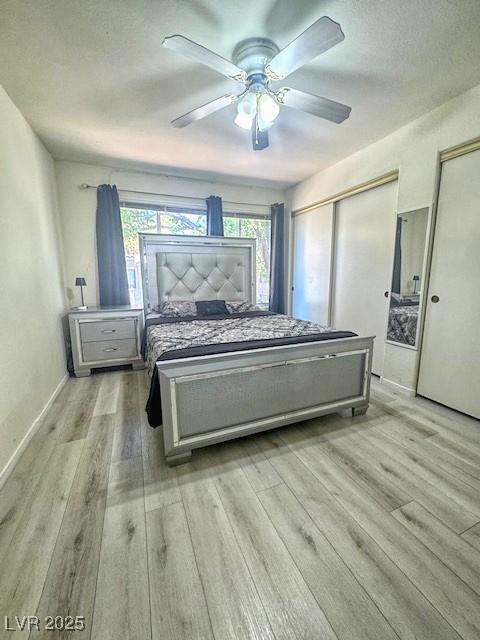 3101 Casey Dr Unit 204, Las Vegas, NV 89120 - bedroom with two closets, light wood-style flooring, and a ceiling fan