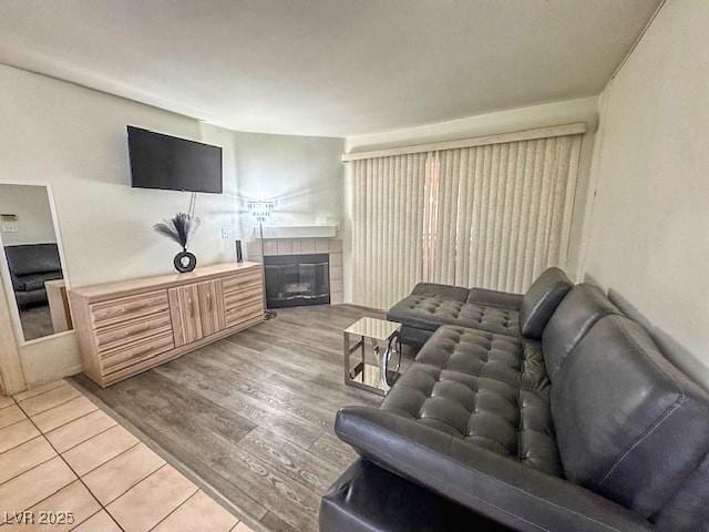 3101 Casey Dr Unit 204, Las Vegas, NV 89120 - living room featuring a tiled fireplace and light tile patterned floors