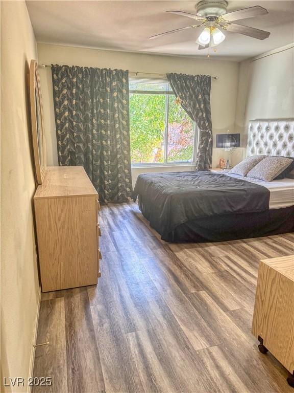 3101 Casey Dr Unit 204, Las Vegas, NV 89120 - bedroom featuring wood finished floors and ceiling fan