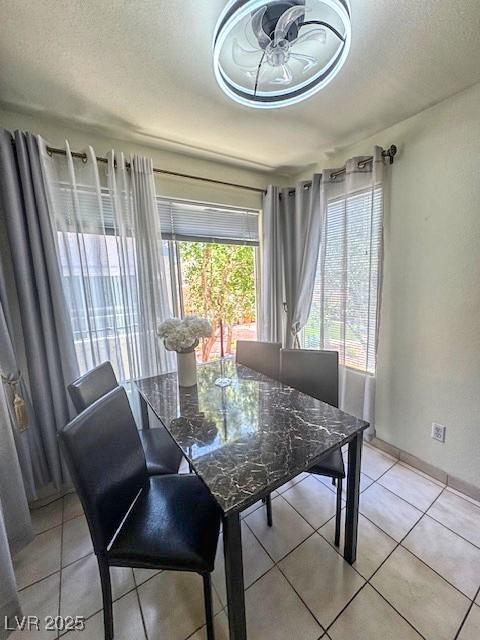 3101 Casey Dr Unit 204, Las Vegas, NV 89120 - dining room featuring light tile patterned floors, ceiling fan, and a textured ceiling
