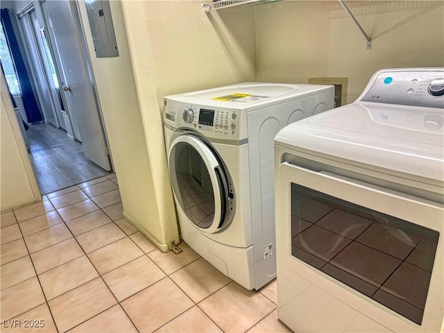 3101 Casey Dr Unit 204, Las Vegas, NV 89120 - washroom with separate washer and dryer, light tile patterned floors, and electric panel