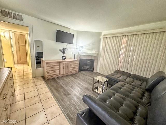3101 Casey Dr Unit 204, Las Vegas, NV 89120 - living room featuring a fireplace and light tile patterned flooring