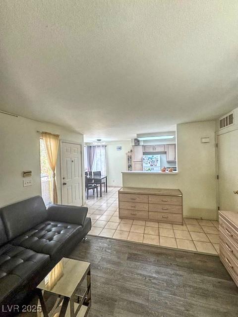 3101 Casey Dr Unit 204, Las Vegas, NV 89120 - living area featuring a textured ceiling and light tile patterned flooring