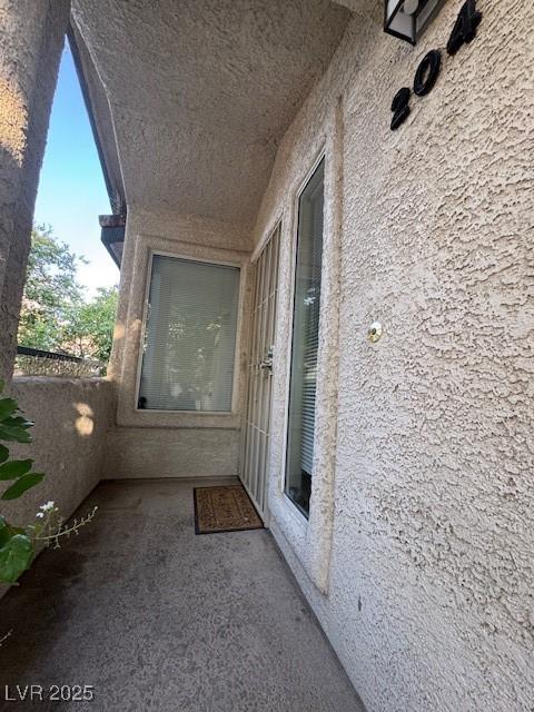 3101 Casey Dr Unit 204, Las Vegas, NV 89120 - view of exterior entry with a balcony and stucco siding