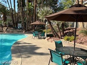 3101 Casey Dr Unit 204, Las Vegas, NV 89120 - swimming pool featuring a patio and outdoor dining area