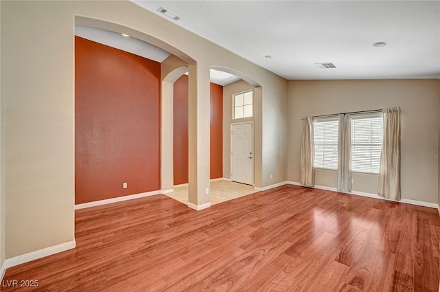 3609 Blue Pimpernel Ave, North Las Vegas, NV 89081 - unfurnished room with arched walkways and light wood finished floors