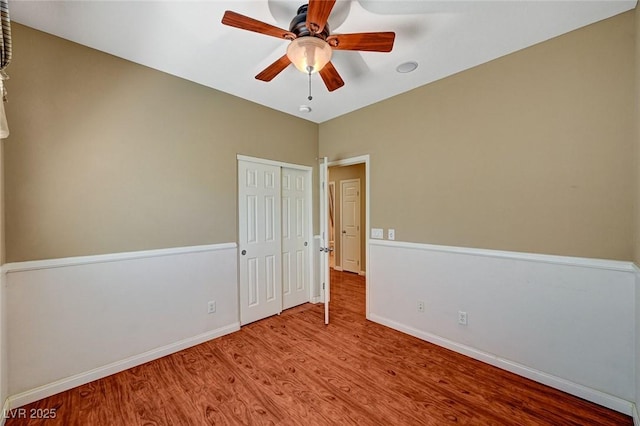 3609 Blue Pimpernel Ave, North Las Vegas, NV 89081 - unfurnished bedroom featuring wood finished floors, a closet, and ceiling fan