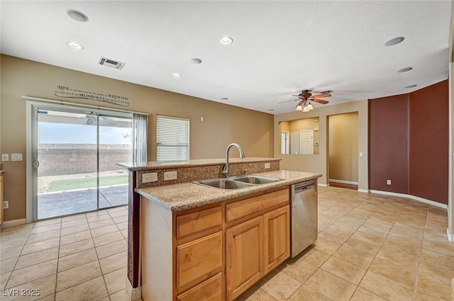 3609 Blue Pimpernel Ave, North Las Vegas, NV 89081 - kitchen with dishwasher, light tile patterned floors, a ceiling fan, a center island with sink, and recessed lighting