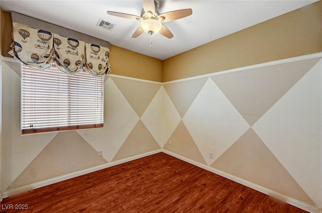 3609 Blue Pimpernel Ave, North Las Vegas, NV 89081 - spare room with wood finished floors and ceiling fan