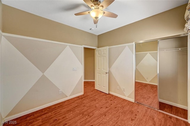 3609 Blue Pimpernel Ave, North Las Vegas, NV 89081 - unfurnished bedroom featuring wood finished floors, a closet, and ceiling fan