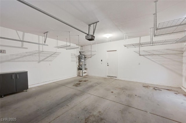 3609 Blue Pimpernel Ave, North Las Vegas, NV 89081 - garage with a garage door opener and water heater
