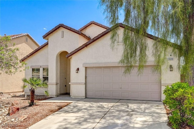 3609 Blue Pimpernel Ave, North Las Vegas, NV 89081 - mediterranean / spanish-style house with an attached garage, stucco siding, and driveway