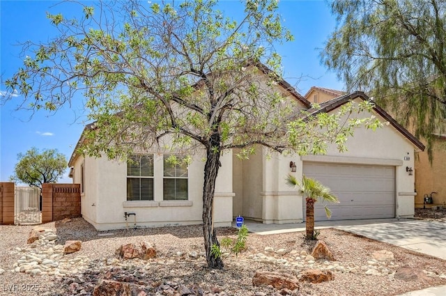 3609 Blue Pimpernel Ave, North Las Vegas, NV 89081 - view of front of home with an attached garage, driveway, and stucco siding