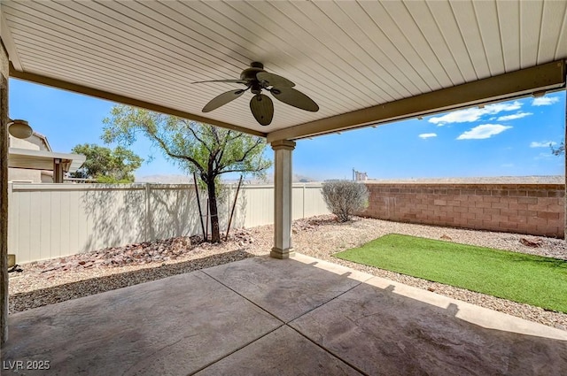 3609 Blue Pimpernel Ave, North Las Vegas, NV 89081 - fenced backyard with a ceiling fan and a patio area