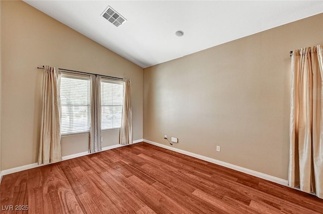 3609 Blue Pimpernel Ave, North Las Vegas, NV 89081 - empty room featuring wood finished floors and lofted ceiling