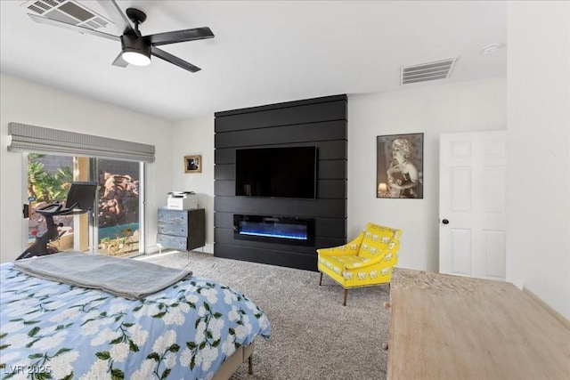9612 Glengarry Dr, Las Vegas, NV 89129 - bedroom with carpet floors, a fireplace, and a ceiling fan