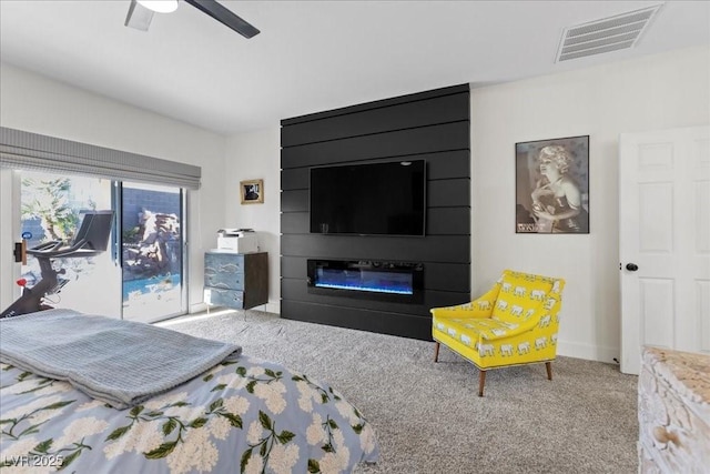 9612 Glengarry Dr, Las Vegas, NV 89129 - carpeted bedroom with a fireplace and ceiling fan