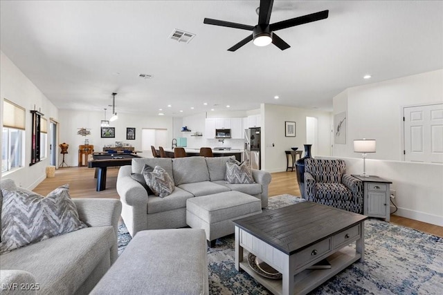 9612 Glengarry Dr, Las Vegas, NV 89129 - living area featuring light wood-style floors, ceiling fan, and recessed lighting