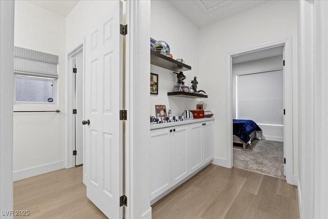 9612 Glengarry Dr, Las Vegas, NV 89129 - hallway with light wood-style flooring and baseboards