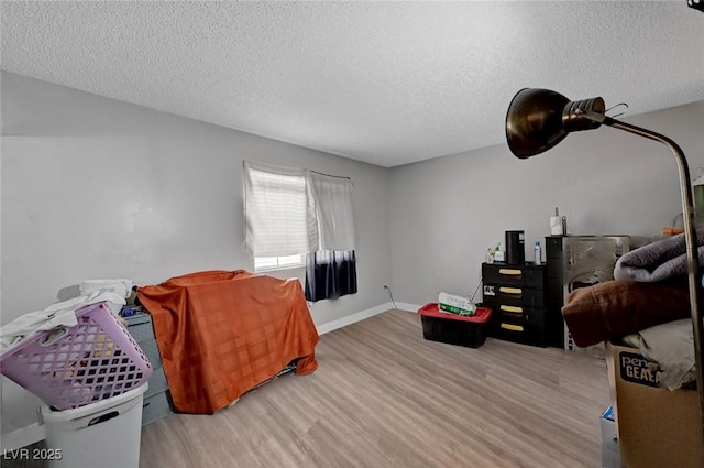 9070 Spring Mountain Rd Unit 114, Las Vegas, NV 89117 - living room featuring wood finished floors and a textured ceiling