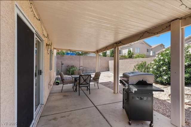 8563 Red Diamond St, Las Vegas, NV 89123 - fenced backyard with outdoor dining area, a patio area, and grilling area
