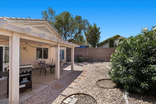 8563 Red Diamond St, Las Vegas, NV 89123 - fenced backyard featuring a patio and a pergola