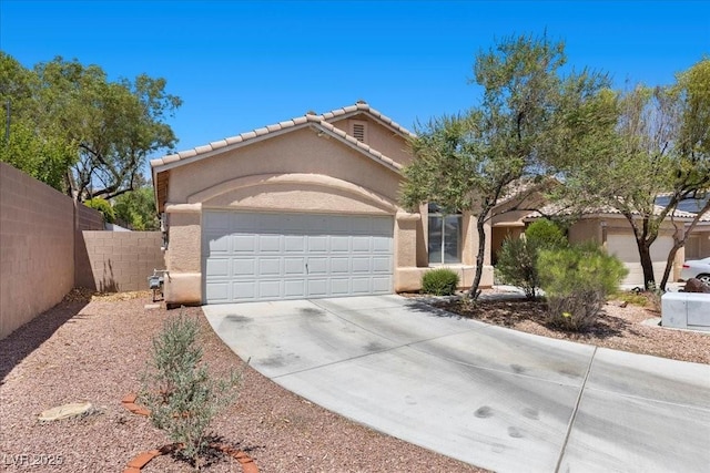8563 Red Diamond St, Las Vegas, NV 89123 - view of front of property featuring concrete driveway, stucco siding, an attached garage, and a tile roof