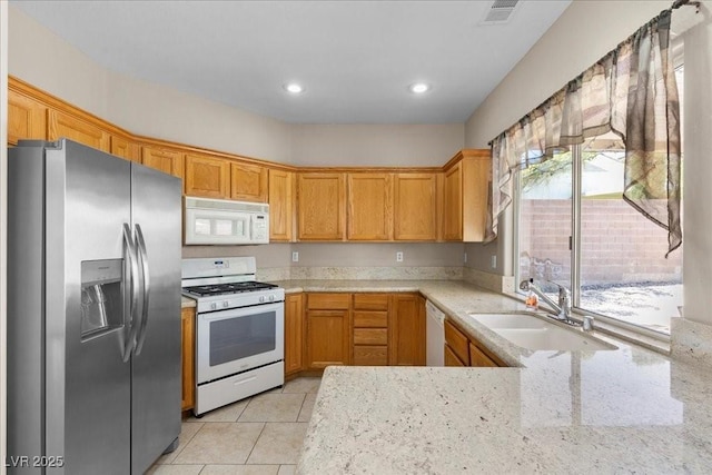 8563 Red Diamond St, Las Vegas, NV 89123 - kitchen featuring white appliances, light stone countertops, light tile patterned flooring, and recessed lighting