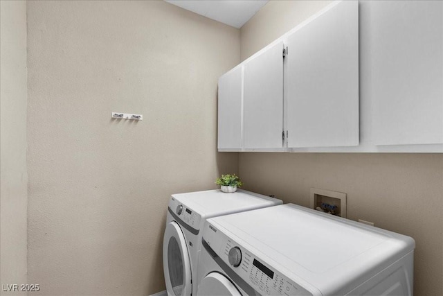 8563 Red Diamond St, Las Vegas, NV 89123 - laundry room with cabinet space and washing machine and clothes dryer