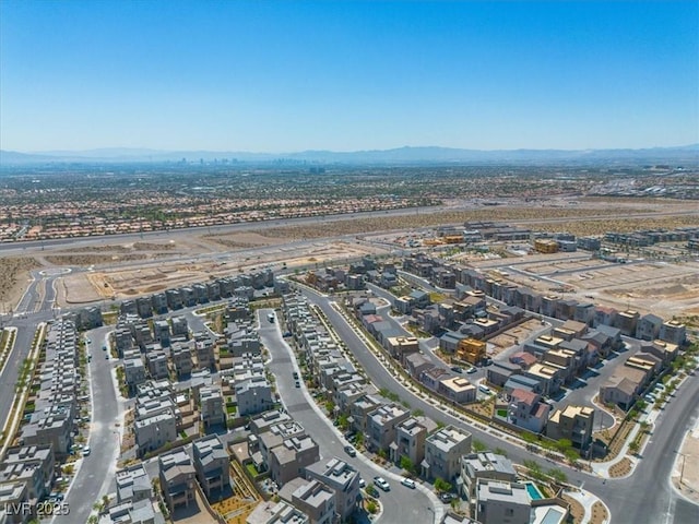 11695 Gentle Birdsong Ave, Las Vegas, NV 89138 - aerial view of property and surrounding area with nearby suburban area and a mountain backdrop