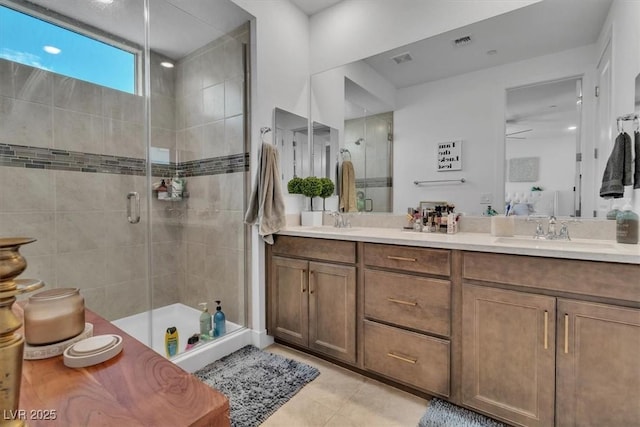 11695 Gentle Birdsong Ave, Las Vegas, NV 89138 - full bathroom with double vanity, a shower stall, and tile patterned flooring