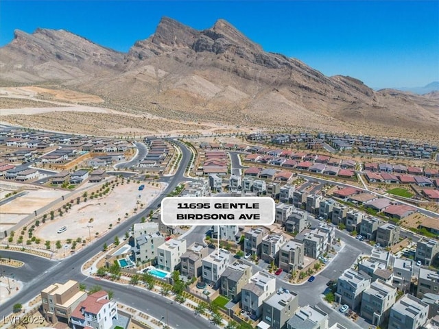 11695 Gentle Birdsong Ave, Las Vegas, NV 89138 - aerial overview of property's location with a mountainous background and nearby suburban area