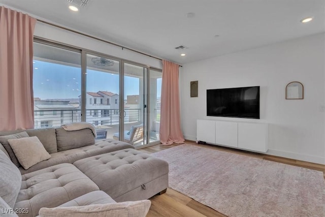 11695 Gentle Birdsong Ave, Las Vegas, NV 89138 - living room featuring wood finished floors and recessed lighting