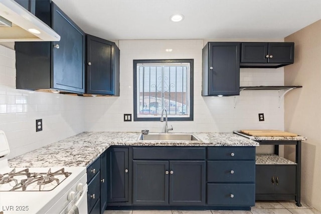 3715 Tabor Ave, North Las Vegas, NV 89030 - kitchen with white range with gas cooktop, under cabinet range hood, tasteful backsplash, open shelves, and light stone counters