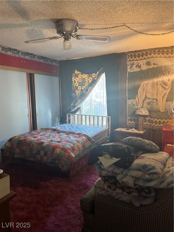 1507 Elizabeth Ave Unit 1, Las Vegas, NV 89119 - bedroom with carpet flooring, a textured ceiling, and a ceiling fan