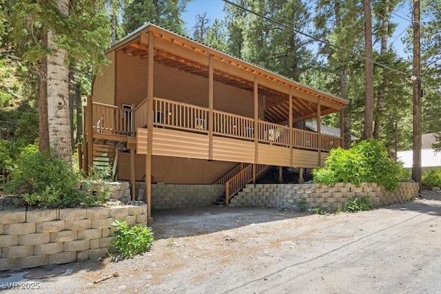 4581 Aspen Ave, Mount Charleston, NV 89124 - view of front of house with stairway and a wooden deck