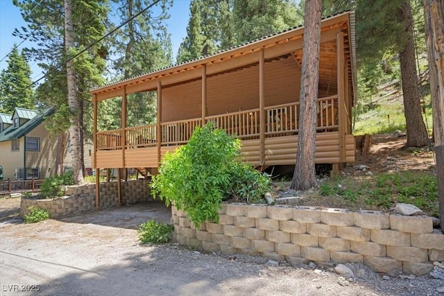 4581 Aspen Ave, Mount Charleston, NV 89124 - rear view of property with a metal roof and a wooden deck