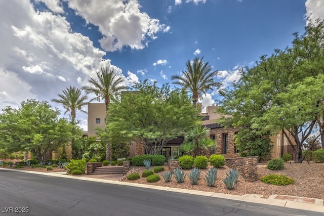 583 Saint Croix St, Henderson, NV 89012 - obstructed view of property featuring roof mounted solar panels, stucco siding, and stone siding